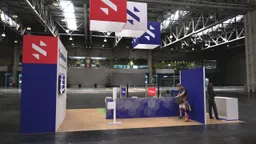 20x20 Island booth design by Reaction Space